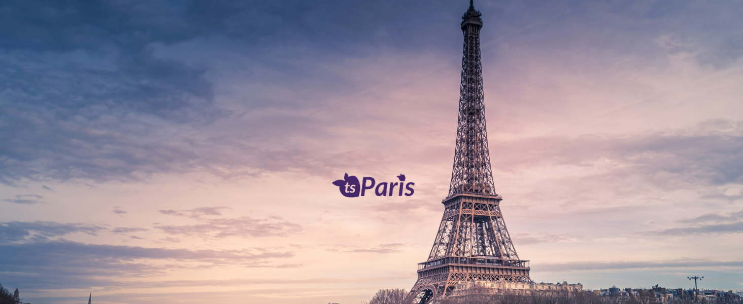 Eiffel Tower with 'Paris' branding against a colorful sky